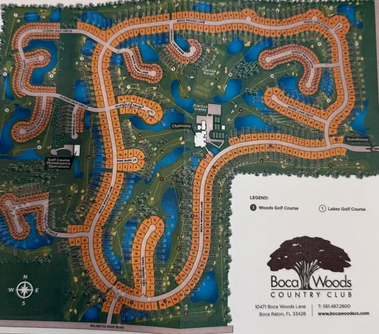 a front view of a house with a garden and a garage