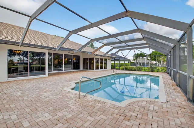 a bedroom with a bed and a chair