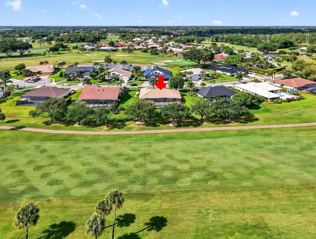 a living room with furniture pool table and a flat screen tv