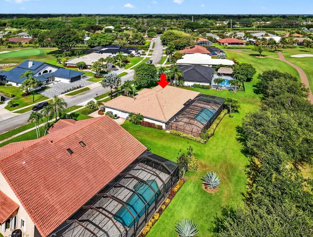an aerial view of a house with a lake view