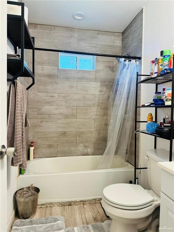 159 East Rodriguez Avenue Raymondville, TX 78580 - Photo 8 of 13 a bathroom with a toilet and a shower