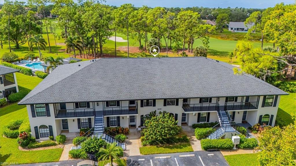 809 Augusta Boulevard, Unit 3 Naples, FL 34113 - Photo 2 of 32 Bird's eye view of a tree filled landscape