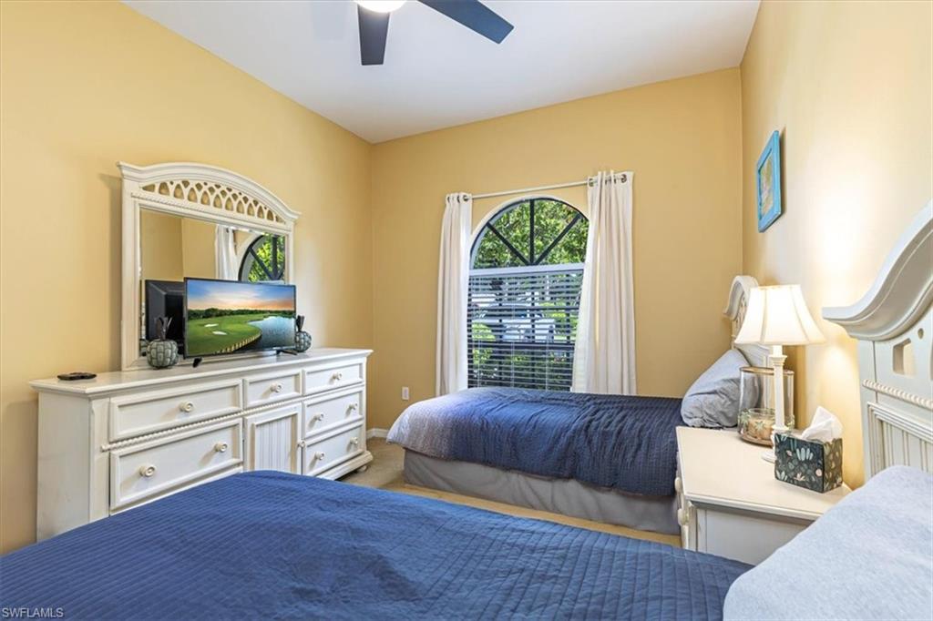 809 Augusta Boulevard, Unit 3 Naples, FL 34113 - Photo 26 of 32 Carpeted bedroom featuring a ceiling fan