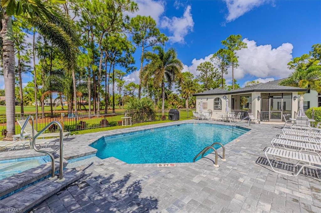 809 Augusta Boulevard, Unit 3 Naples, FL 34113 - Photo 30 of 32 View of pool featuring a patio area and a grill