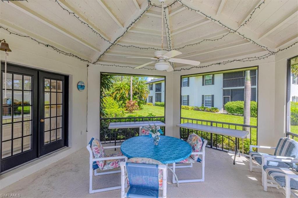 809 Augusta Boulevard, Unit 3 Naples, FL 34113 - Photo 31 of 32 Community Club House featuring ceiling fan, outdoor dining space, and French doors