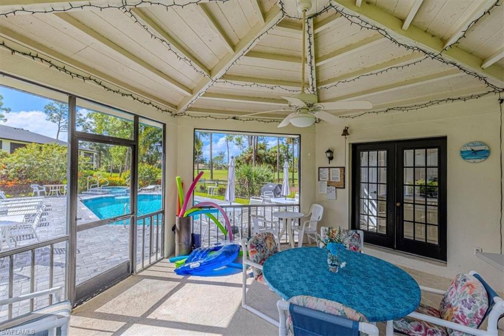 809 Augusta Boulevard, Unit 3 Naples, FL 34113 - Photo 32 of 32 Community Club House featuring ceiling fan, outdoor dining space, and French doors