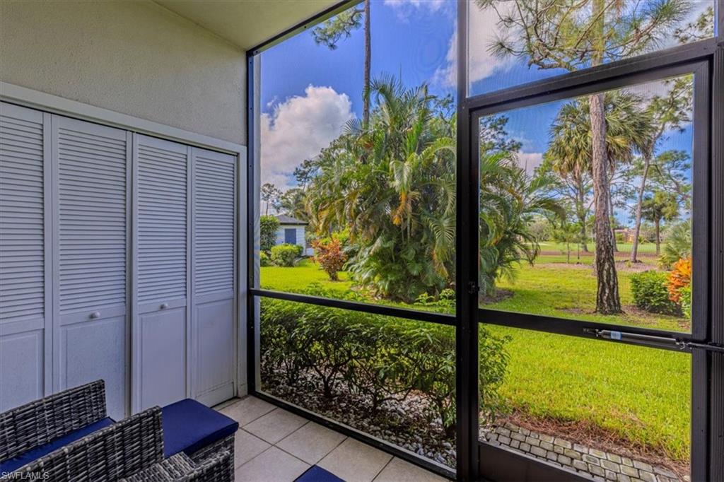 809 Augusta Boulevard, Unit 3 Naples, FL 34113 - Photo 7 of 32 View of golf course from screened in patio