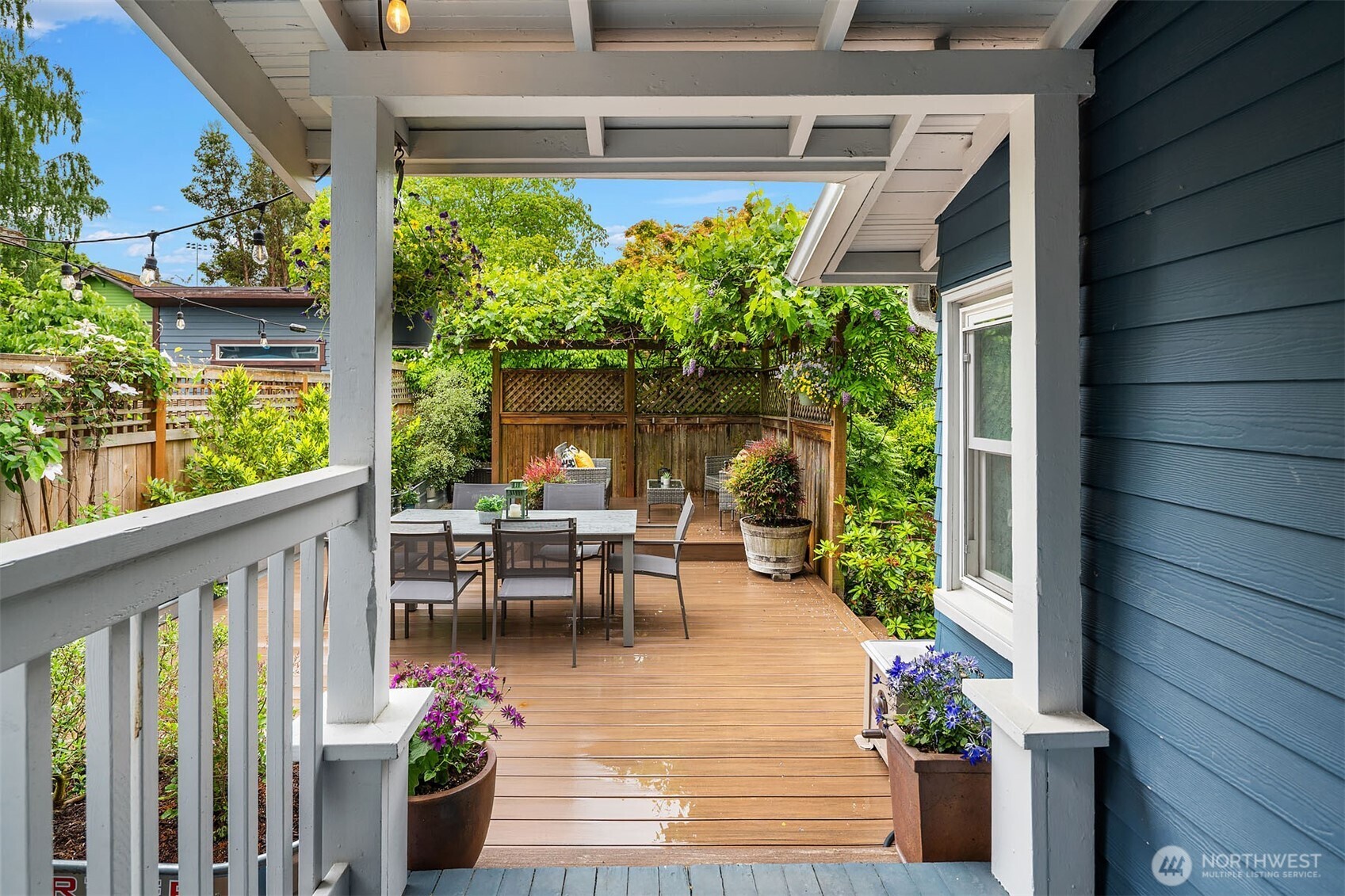519 27th Avenue Seattle, WA 98122 - Photo 27 of 38 a view of a porch with chairs and potted plants