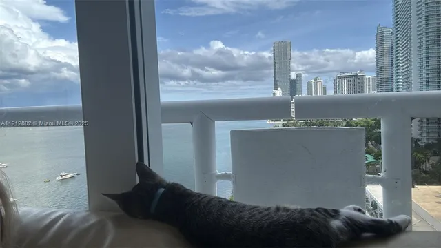 a view of a balcony with wooden floor and fence