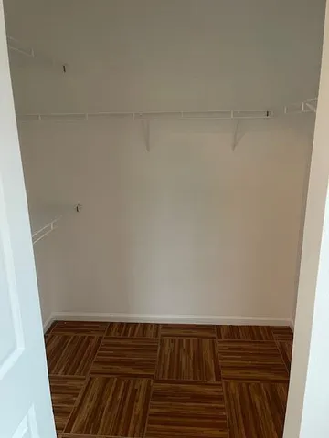 a bathroom with a granite countertop toilet and a sink