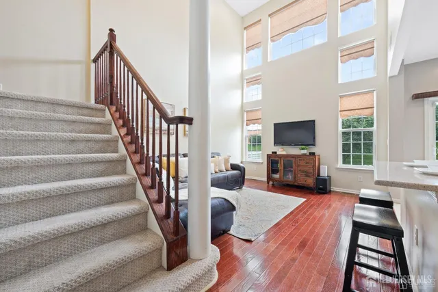 a view of a livingroom with furniture and a flat screen tv