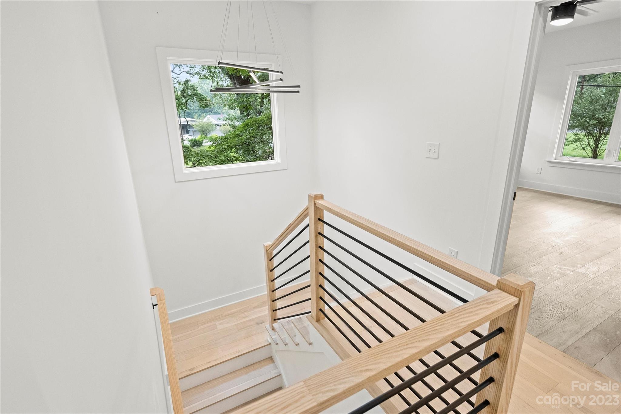 1608 Chippendale Road Charlotte, NC 28205 - Photo 19 of 34 a view of a hallway with wooden floor and a window