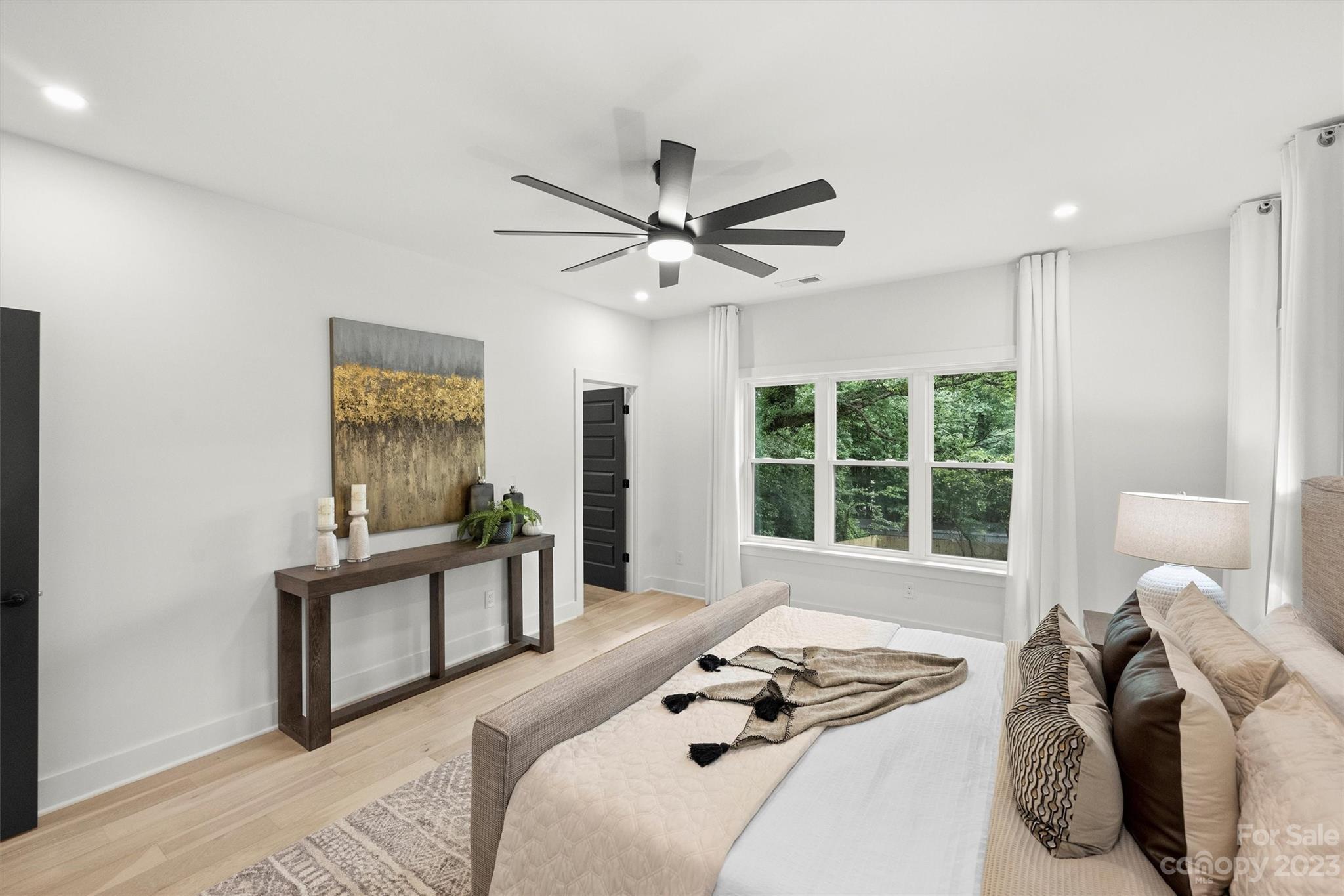 1608 Chippendale Road Charlotte, NC 28205 - Photo 21 of 34 a bedroom with a bed and a window