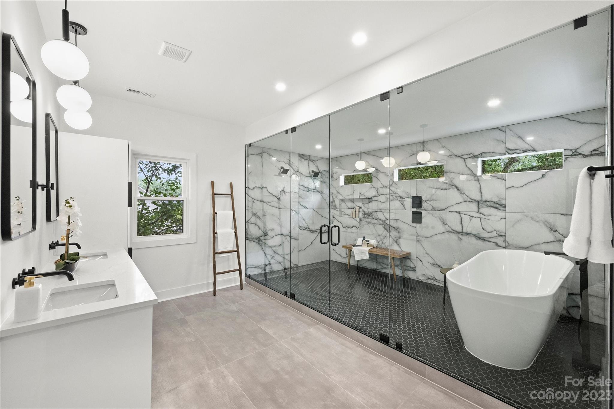 1608 Chippendale Road Charlotte, NC 28205 - Photo 22 of 34 a bathroom with a sink toilet and shower