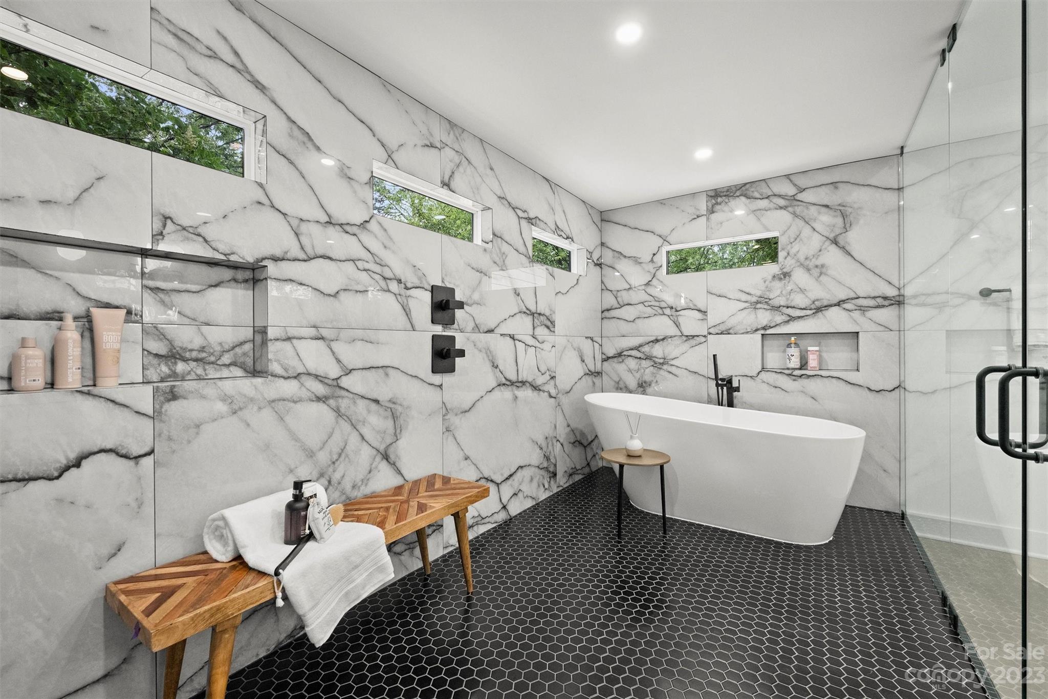 1608 Chippendale Road Charlotte, NC 28205 - Photo 24 of 34 a bathroom with a sink toilet and shower