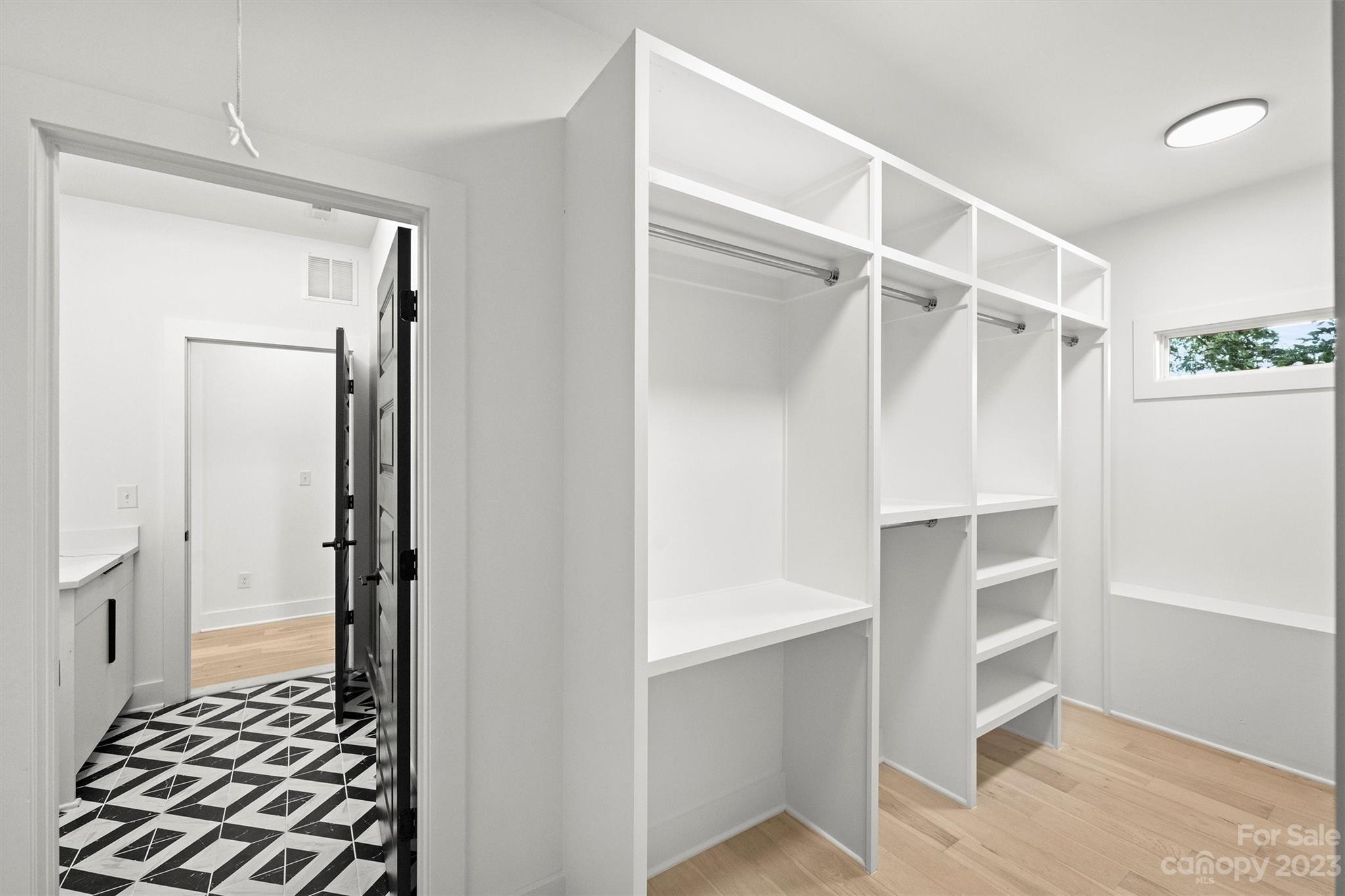 1608 Chippendale Road Charlotte, NC 28205 - Photo 27 of 34 a view of closet area with empty racks