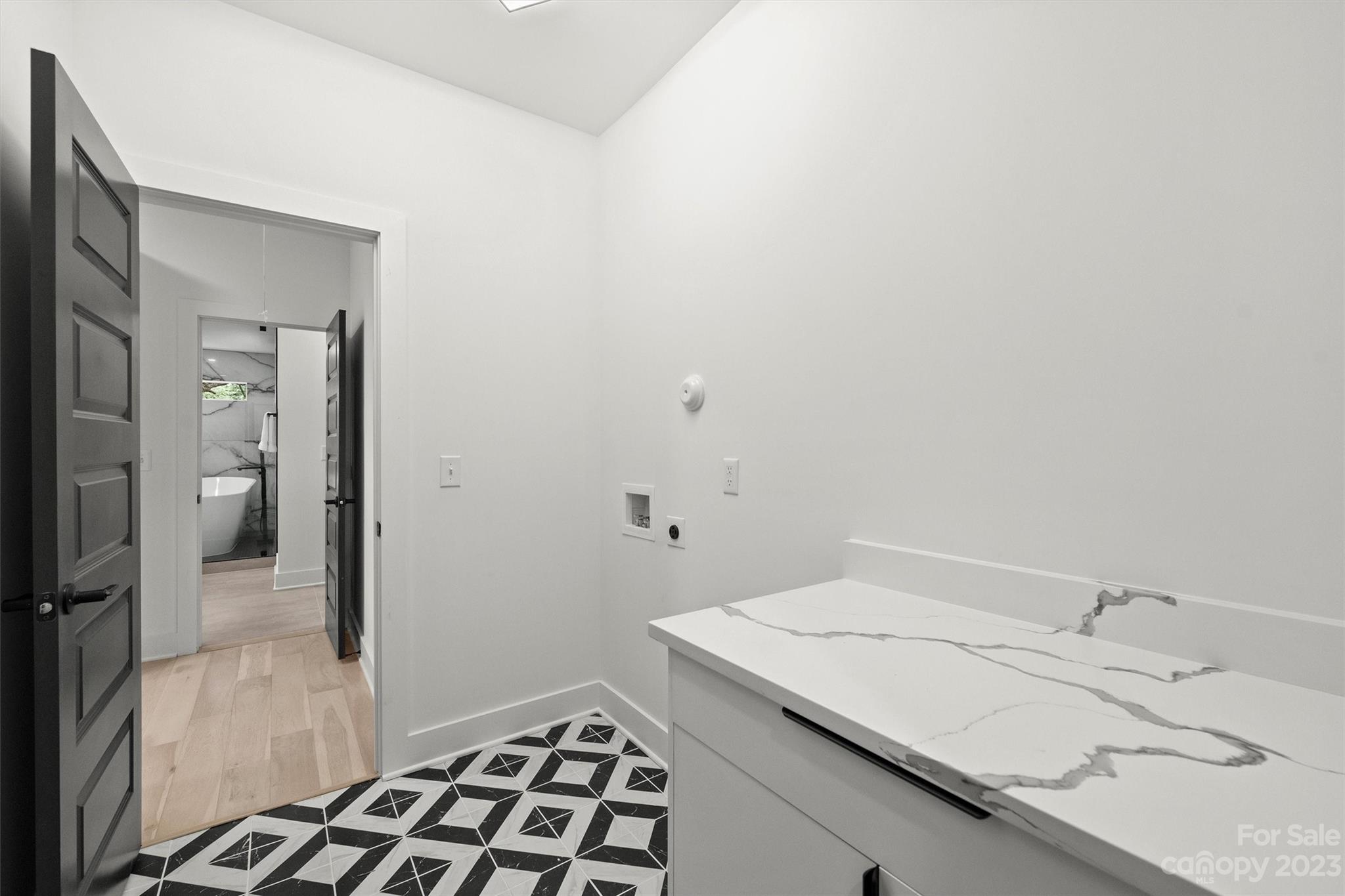 1608 Chippendale Road Charlotte, NC 28205 - Photo 28 of 34 a bathroom with a sink and a mirror