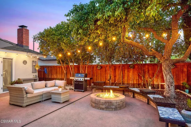 an aerial view of a house with yard swimming pool and outdoor seating