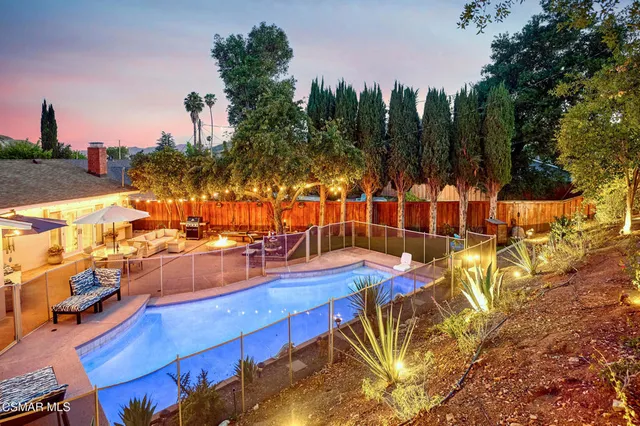 a outdoor space with patio lots of furniture and umbrella