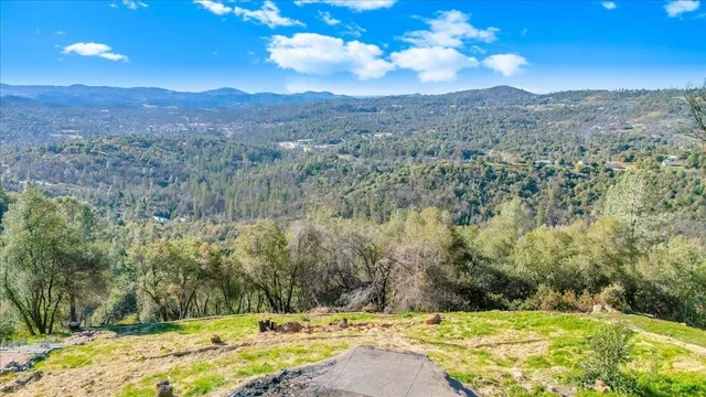 a view of a backyard of the house