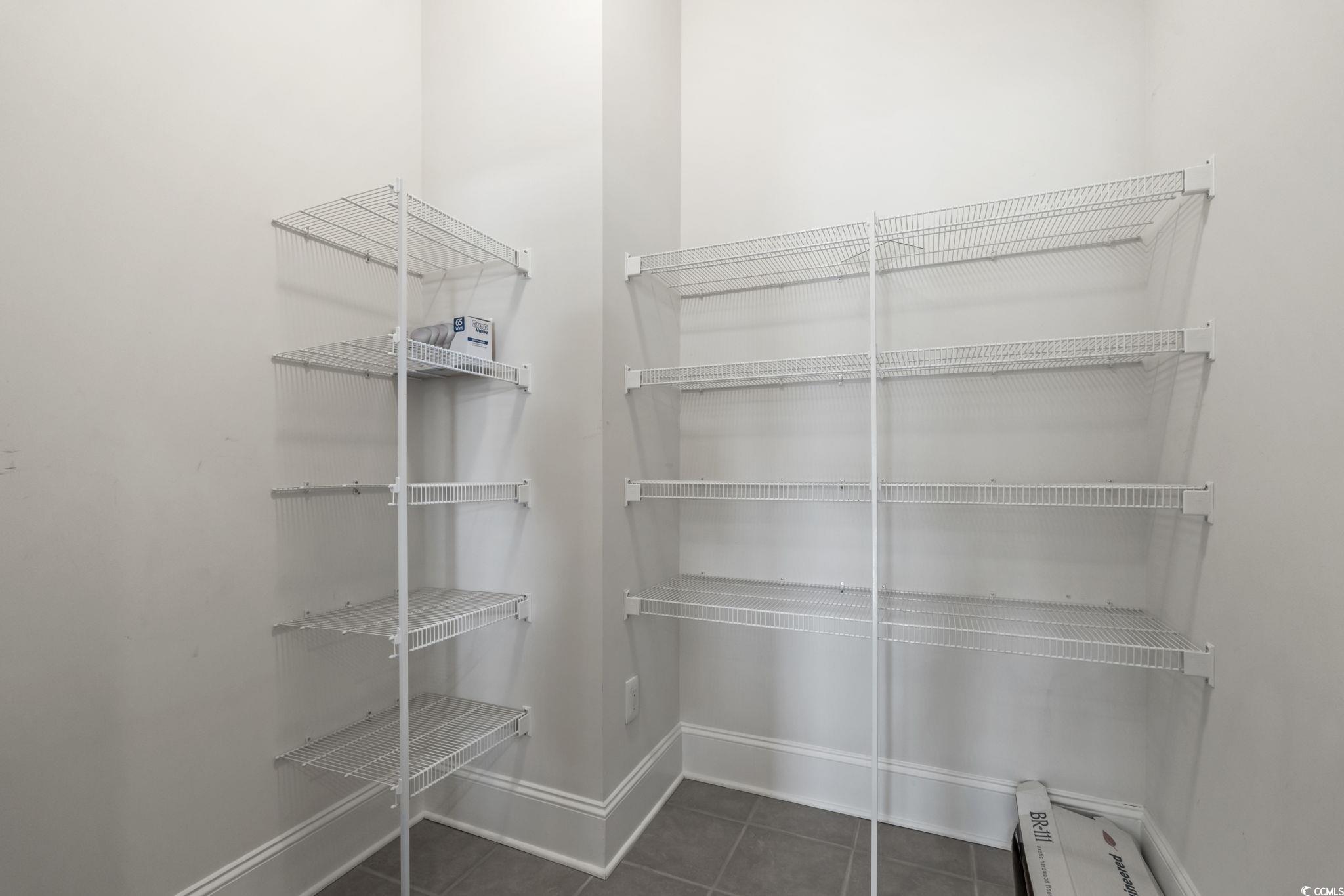 249 Venice Way, Unit 3301 Myrtle Beach, SC 29577 - Photo 12 of 40 Spacious closet featuring dark tile patterned flooring