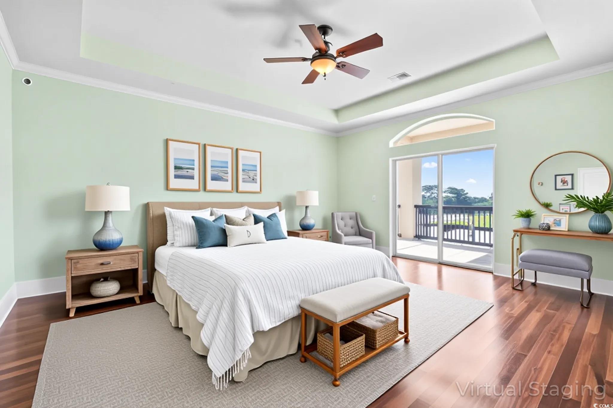 249 Venice Way, Unit 3301 Myrtle Beach, SC 29577 - Photo 19 of 40 Bedroom featuring a tray ceiling, dark wood-type flooring, ceiling fan, access to outside, and ornamental molding