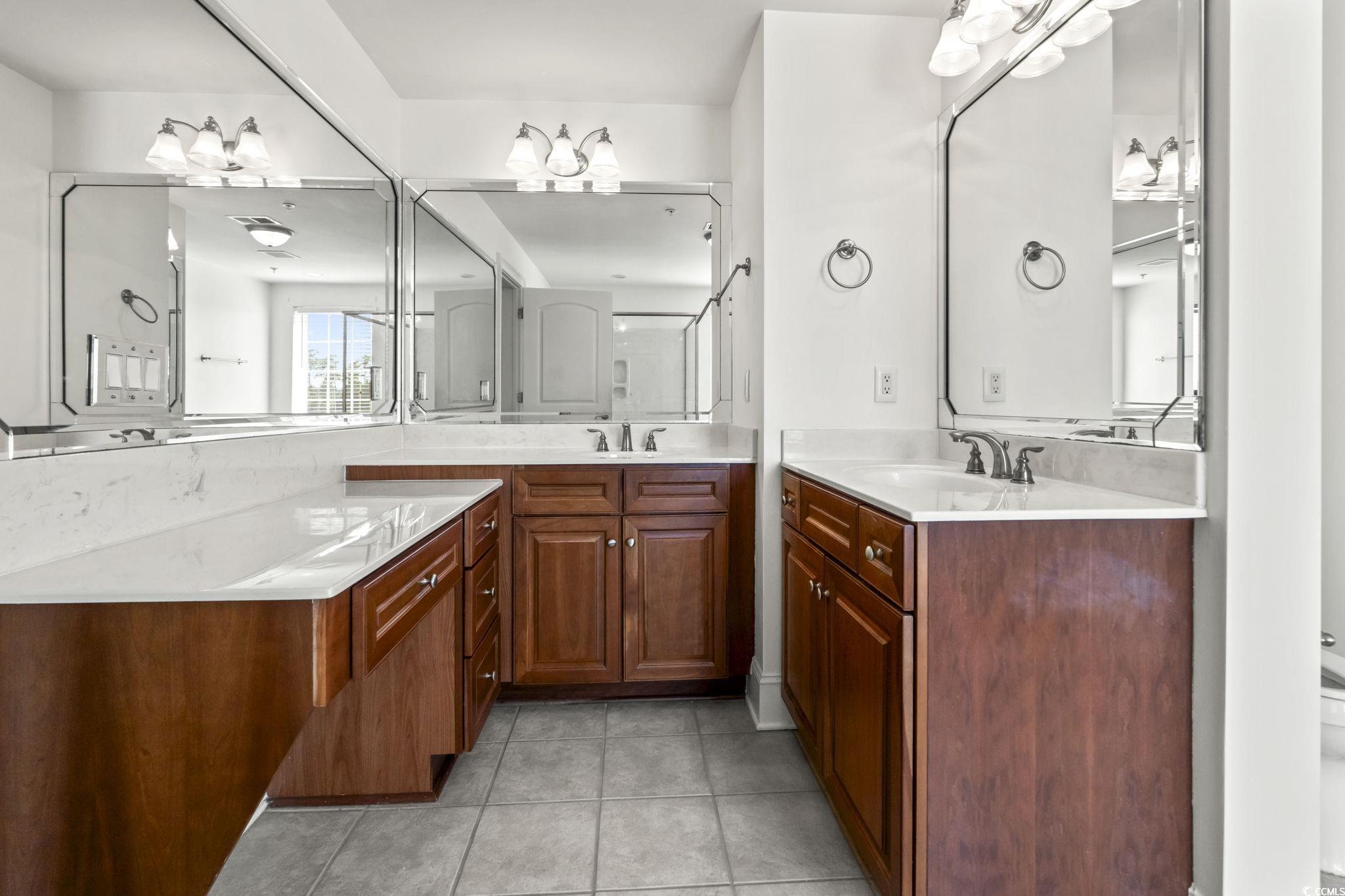 249 Venice Way, Unit 3301 Myrtle Beach, SC 29577 - Photo 23 of 40 Bathroom with two vanities and light tile patterned floors