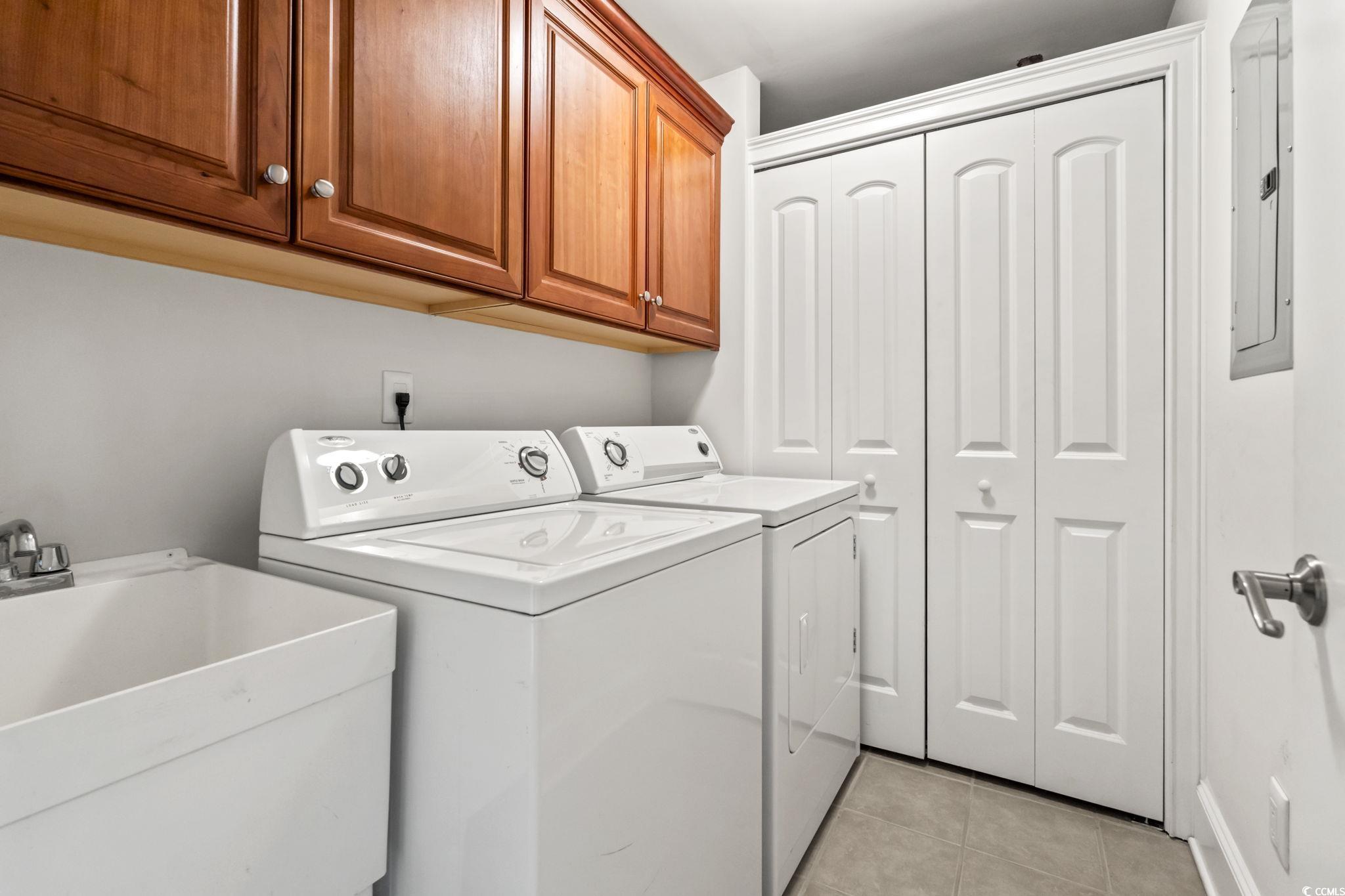249 Venice Way, Unit 3301 Myrtle Beach, SC 29577 - Photo 32 of 40 Laundry area with light tile patterned floors, independent washer and dryer, cabinet space, and electric panel