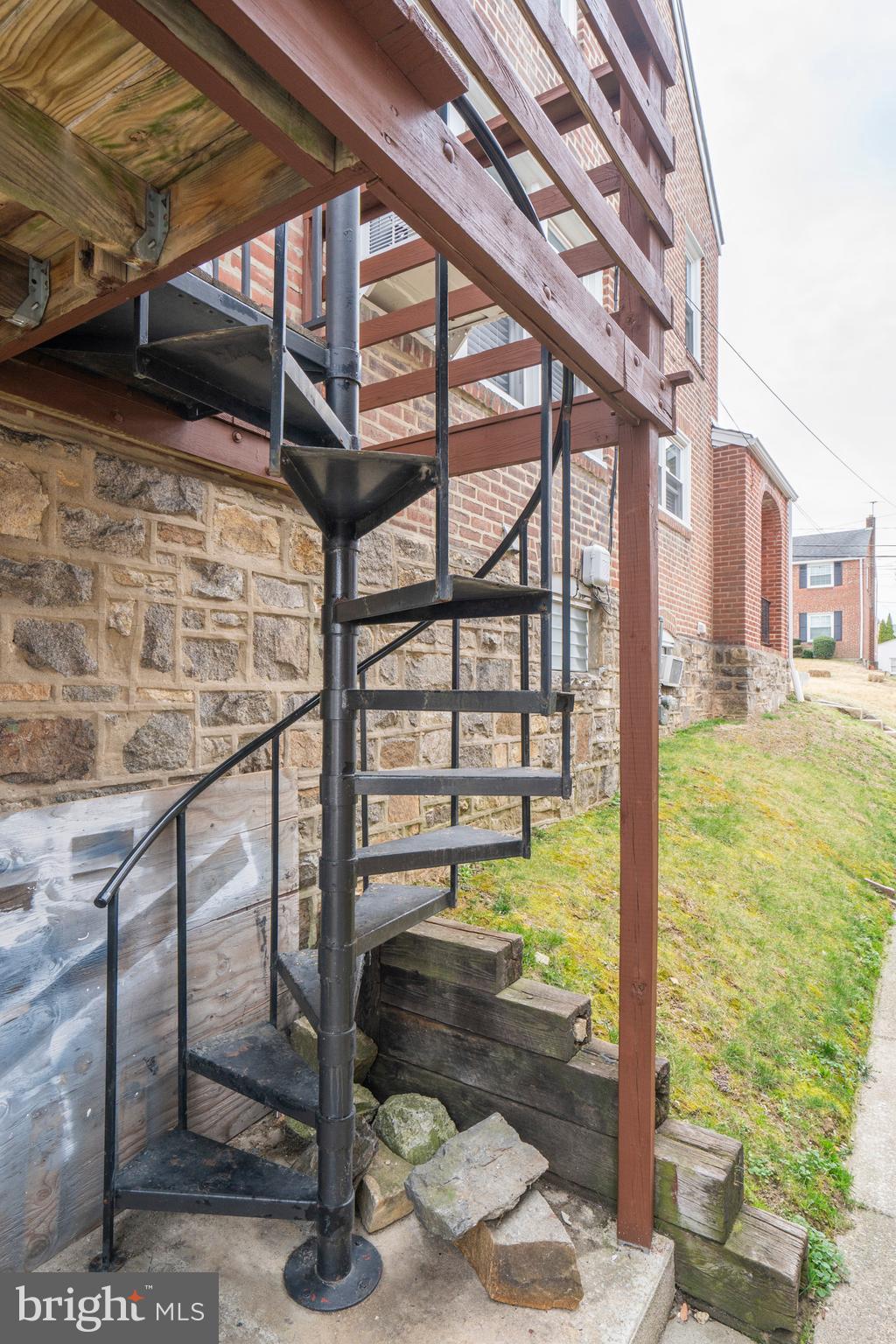105 Wayne Avenue Springfield, PA 19064 - Photo 29 of 49 Spiral Stairs Outside of Kitchen To Back of House