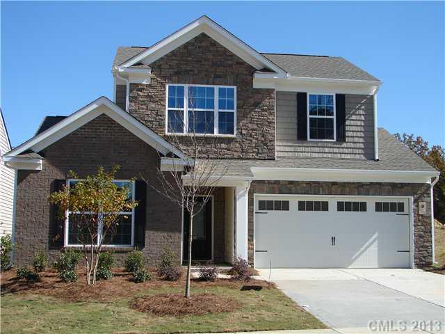 4009 Perth Road, Unit 402 Indian Land, SC 29707 - Photo 1 of 8 a front view of a house with garden