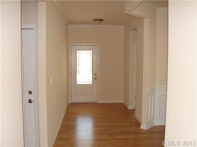 4009 Perth Road, Unit 402 Indian Land, SC 29707 - Photo 2 of 8 a view of a hallway with wooden floor