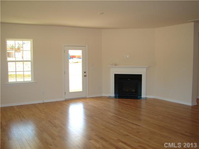 4009 Perth Road, Unit 402 Indian Land, SC 29707 - Photo 5 of 8 wooden floor fireplace and natural light in room
