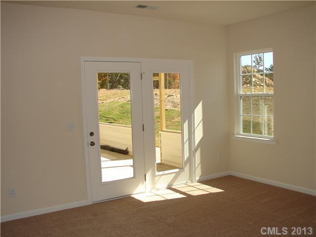 4009 Perth Road, Unit 402 Indian Land, SC 29707 - Photo 7 of 8 a view of wooden floor and windows in a room