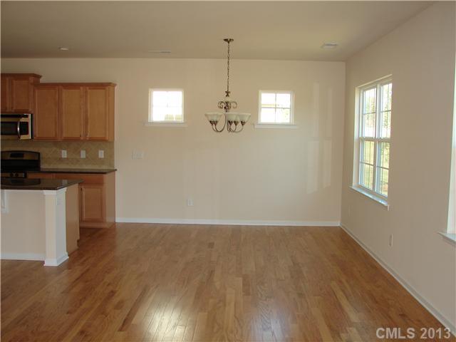 4009 Perth Road, Unit 402 Indian Land, SC 29707 - Photo 8 of 8 a view of a kitchen with wooden floor and windows