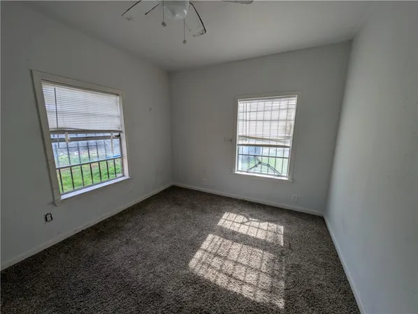 a view of empty room with windows