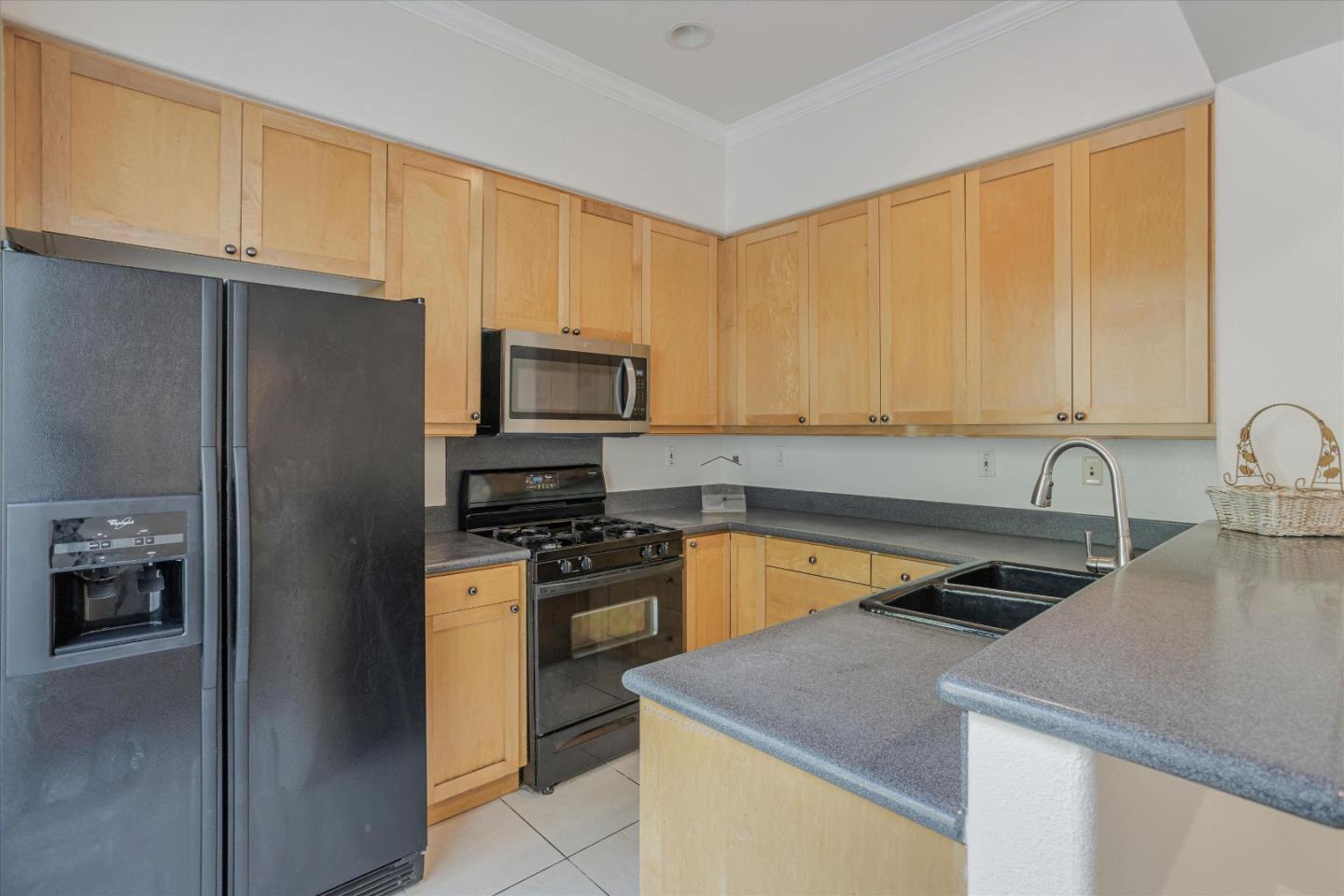 105 Serenity Place Milpitas, CA 95035 - Photo 11 of 36 a kitchen with a sink a stove and refrigerator