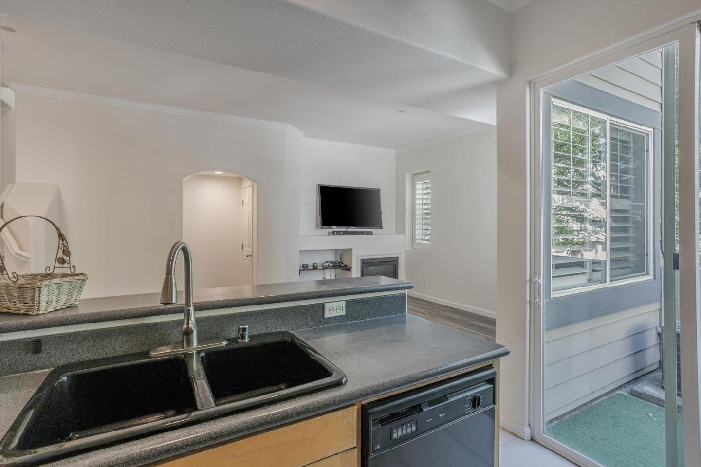 105 Serenity Place Milpitas, CA 95035 - Photo 14 of 36 a kitchen with a sink and a stove