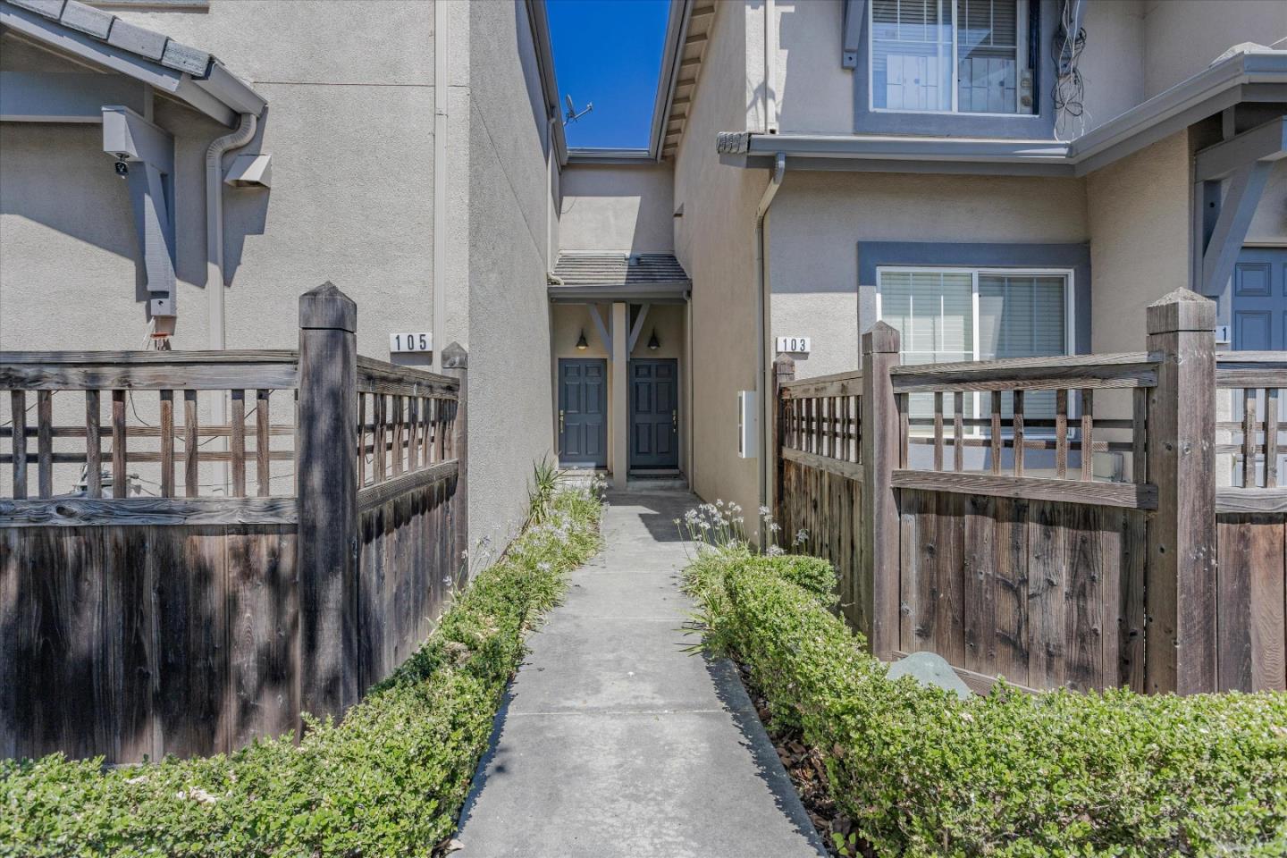 105 Serenity Place Milpitas, CA 95035 - Photo 2 of 36 a view of a pathway of a house with a small yard and wooden floor and fence