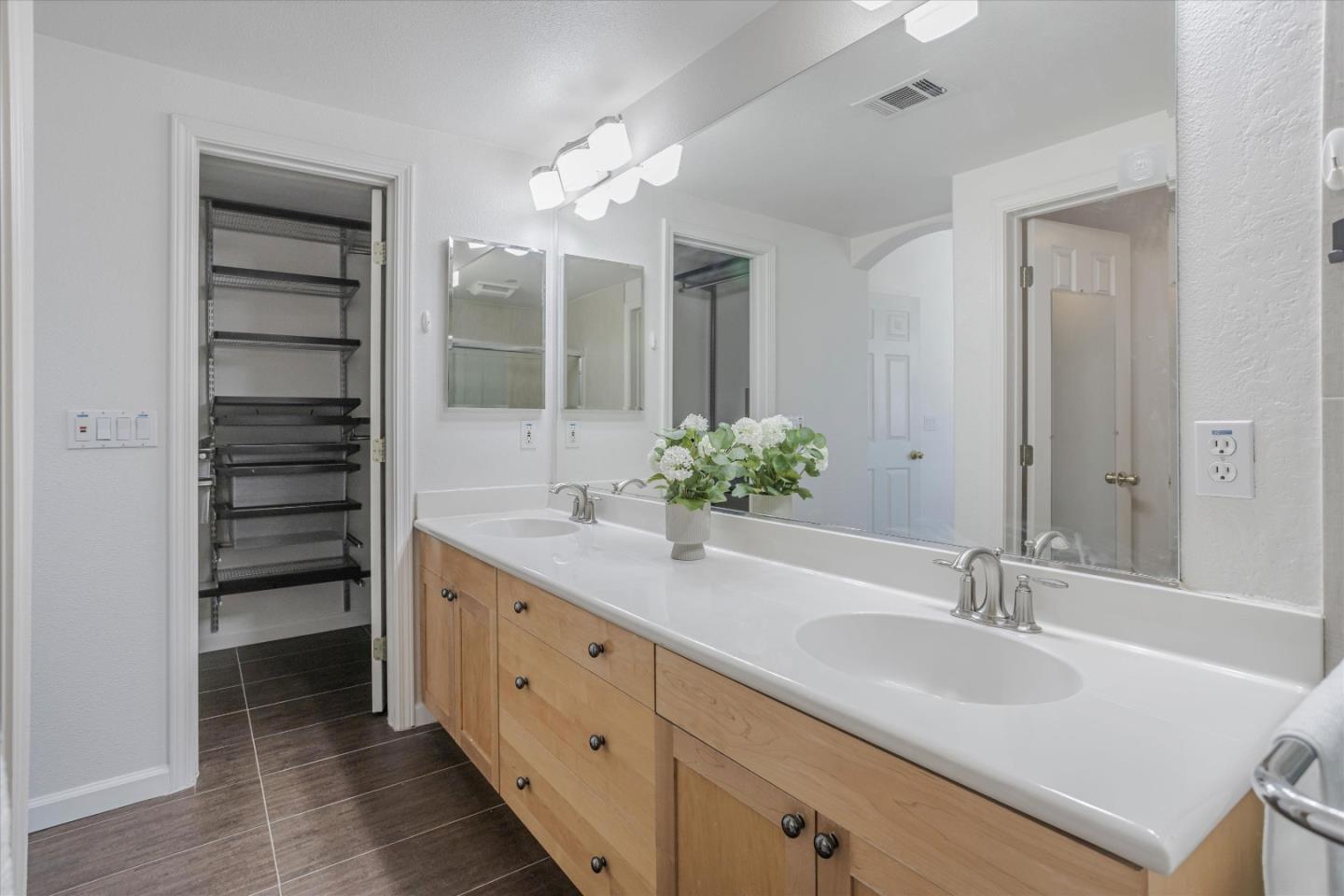 105 Serenity Place Milpitas, CA 95035 - Photo 26 of 36 a bathroom with a double vanity sink and a mirror