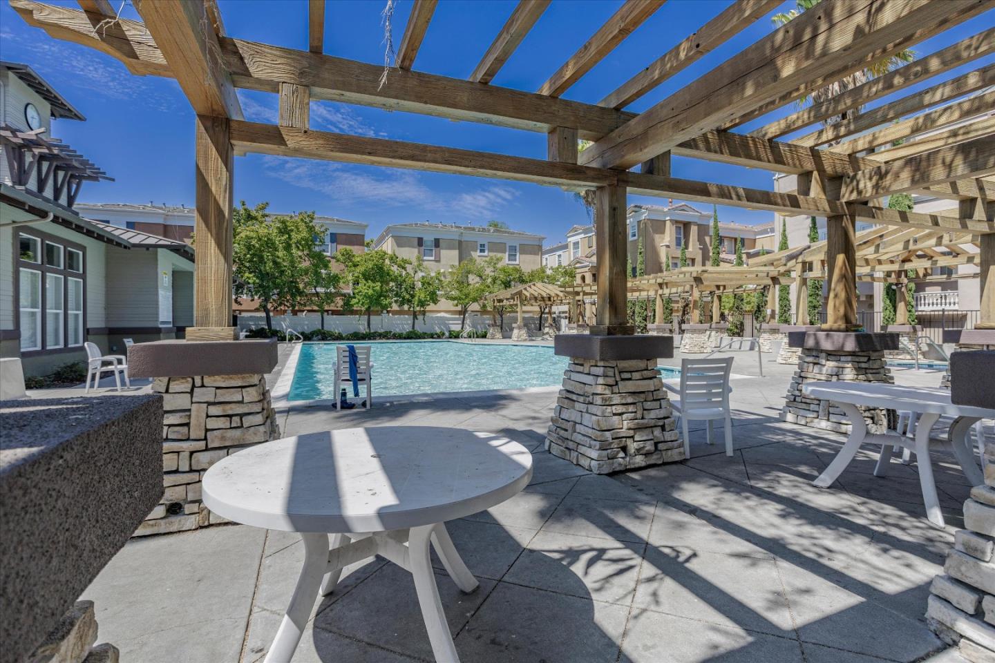 105 Serenity Place Milpitas, CA 95035 - Photo 31 of 36 a view of a patio with couches table and chairs and potted plants
