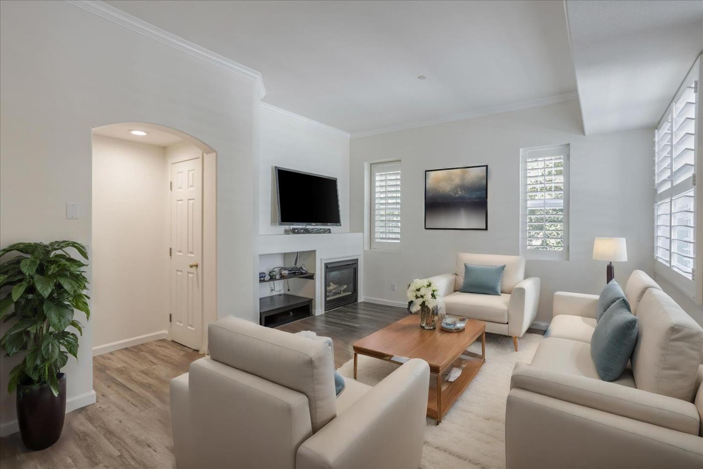 105 Serenity Place Milpitas, CA 95035 - Photo 6 of 36 a living room with furniture and a flat screen tv