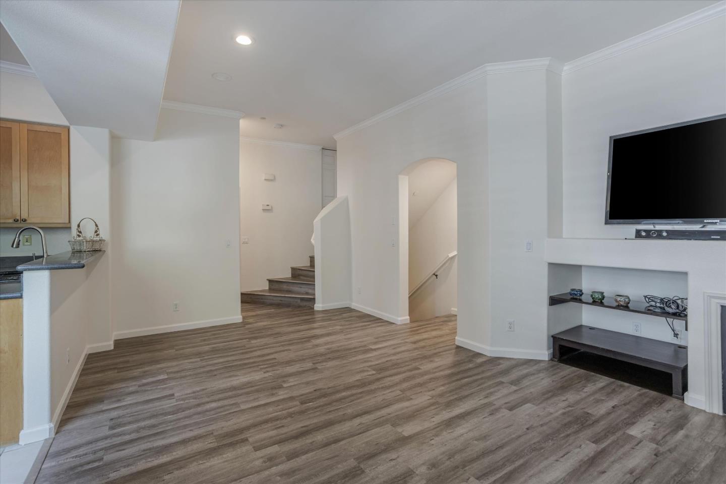 105 Serenity Place Milpitas, CA 95035 - Photo 7 of 36 a view of a livingroom with wooden floor and a fireplace