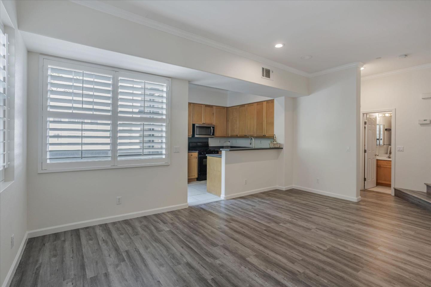 105 Serenity Place Milpitas, CA 95035 - Photo 10 of 36 a view of empty room with wooden floor and window