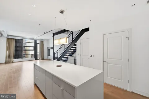 a view of an entryway with wooden floor