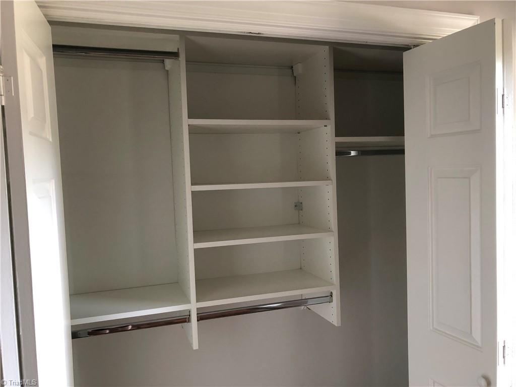 1209 Stadler Ridge Road Winston-Salem, NC 27106 - Photo 18 of 28 Master bedroom closet with hanging rods and shelving