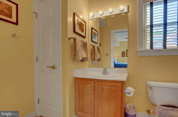 a hallway with wooden floor and furniture