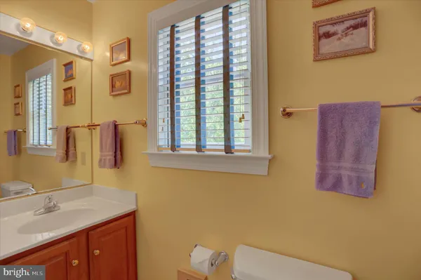 a view of a room with furniture and window