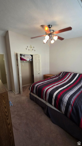 1330 North Dixie Downs Road, Unit 72 St. George, UT 84770 - Photo 19 of 21 Bedroom with ceiling fan and carpet floors