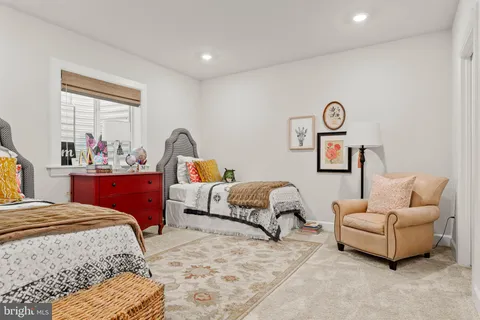a bedroom with bed and a couch