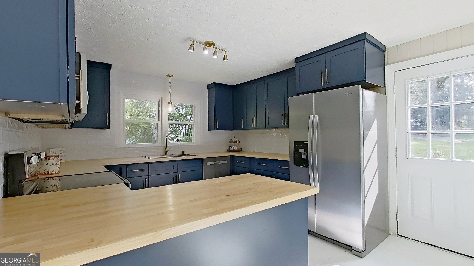 481 4th Street Southeast Cairo, GA 39828 - Photo 12 of 55 a kitchen with stainless steel appliances a refrigerator and a sink